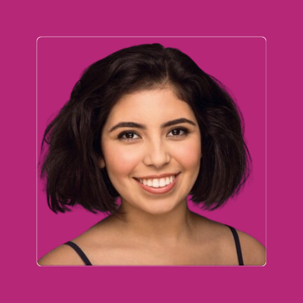Nina, career identity crisis coaching client, smiling headshot on a magenta background